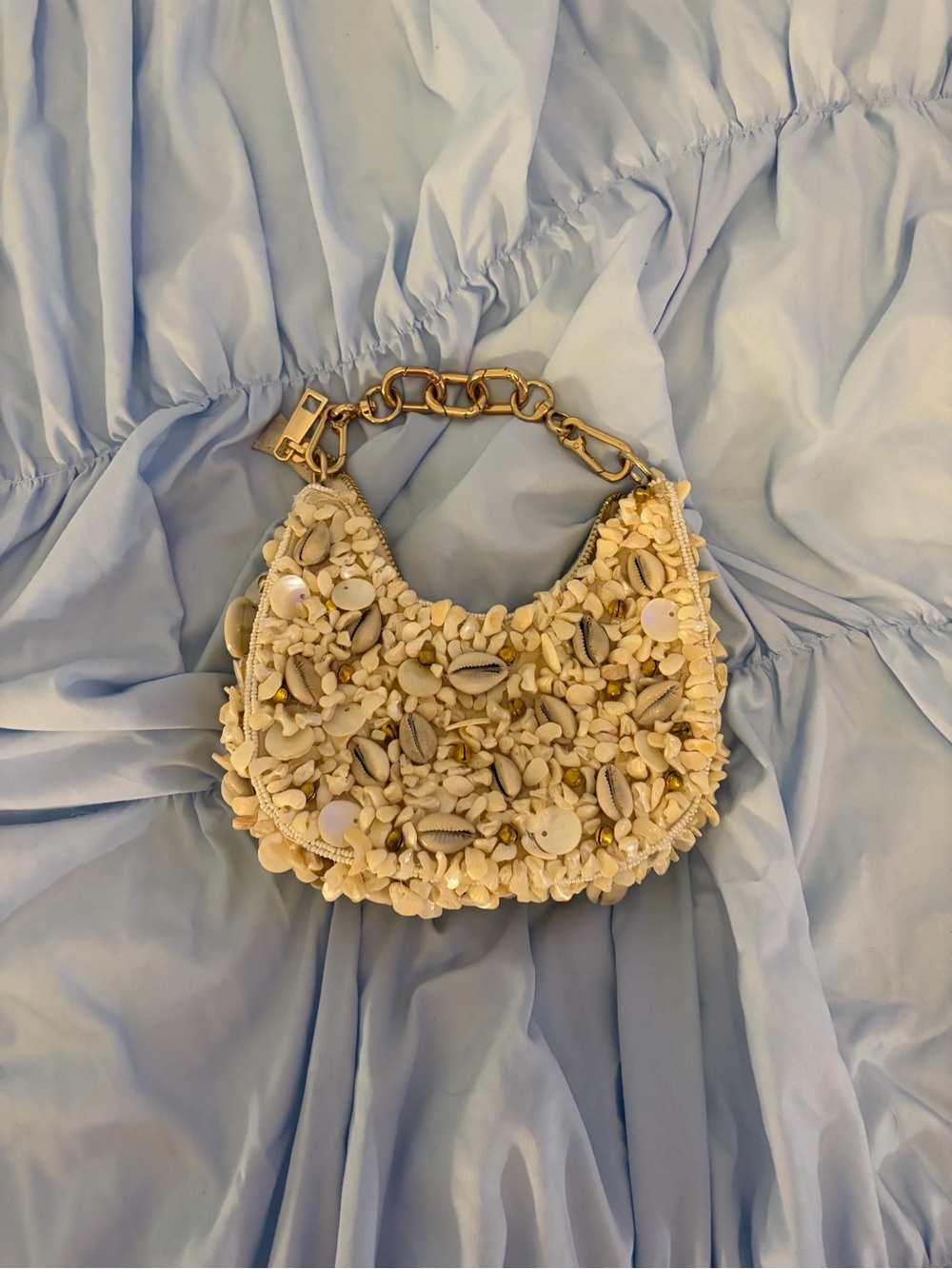 Shell-Embellished Cream Shoulder Bag with Gold Chain